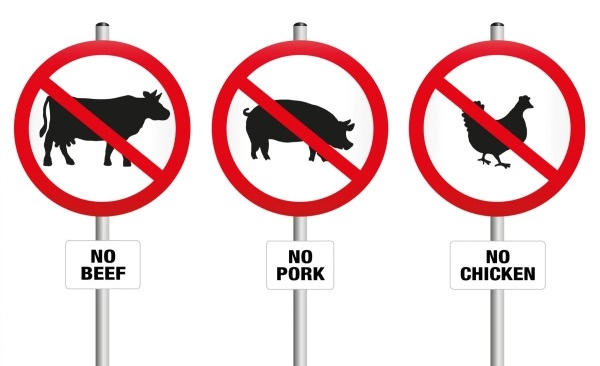 Three stop signs titled no beef, no pork, no chicken