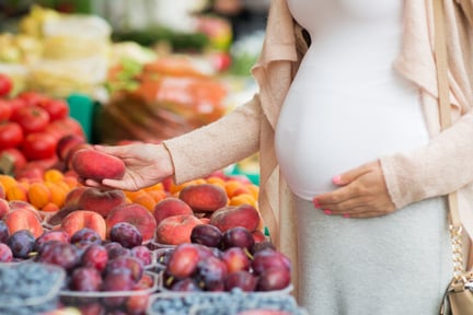 Pregnant lady with fruits 