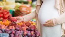 Pregnant lady with fruits 