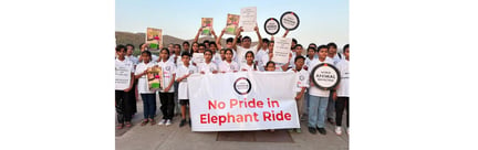 Young participants hold artwork and banners promoting wildlife conservation during a World Environment Day event in Jaipur.